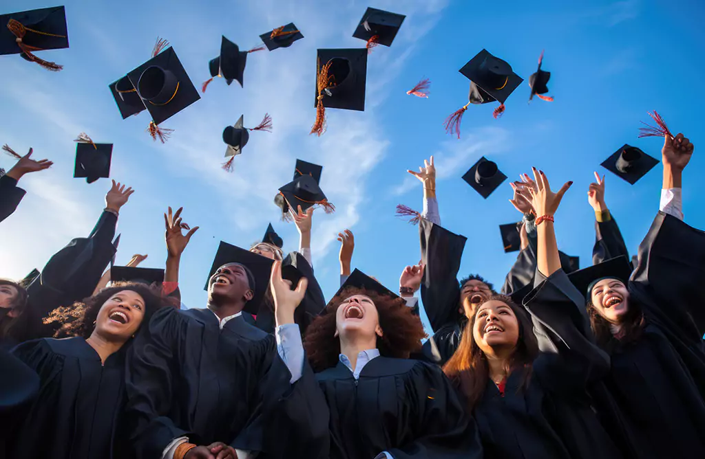 Happy Graduates Celebrating by Tossing Caps in the Air