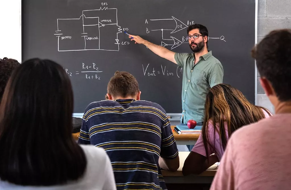 Professor Teaching Electronics Circuit in Classroom