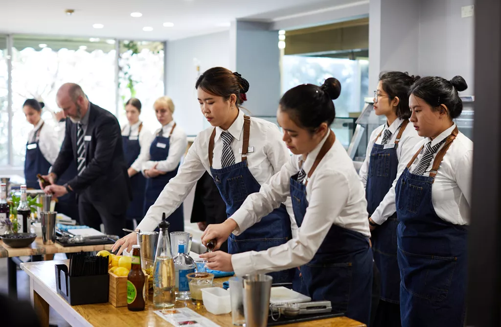 Hotel Management Students Practicing Culinary Skills