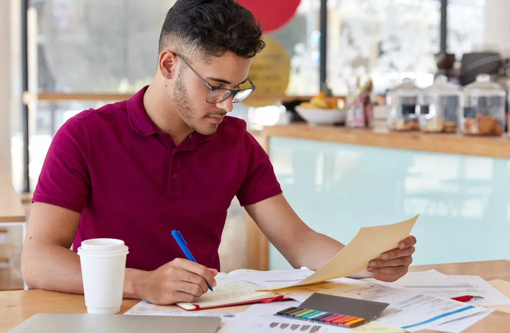 Student studying documents for study abroad preparation