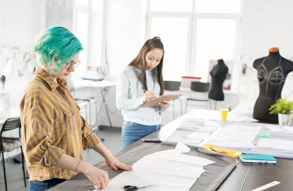 Interior of a Modern Fashion Design Studio with Students