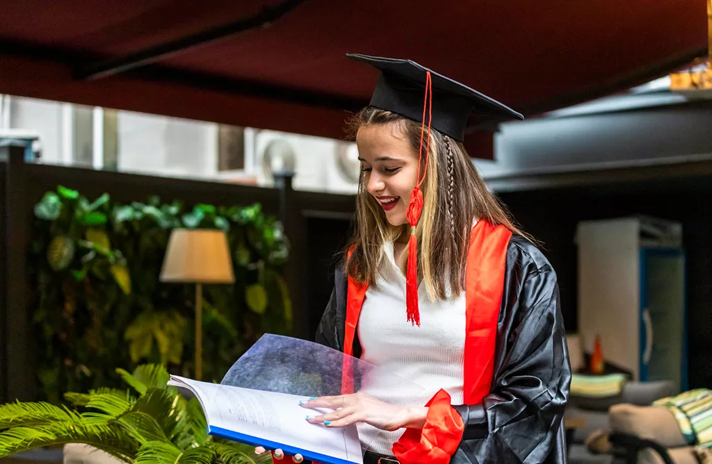 Student in Graduation Gown Celebrating Success Abroad