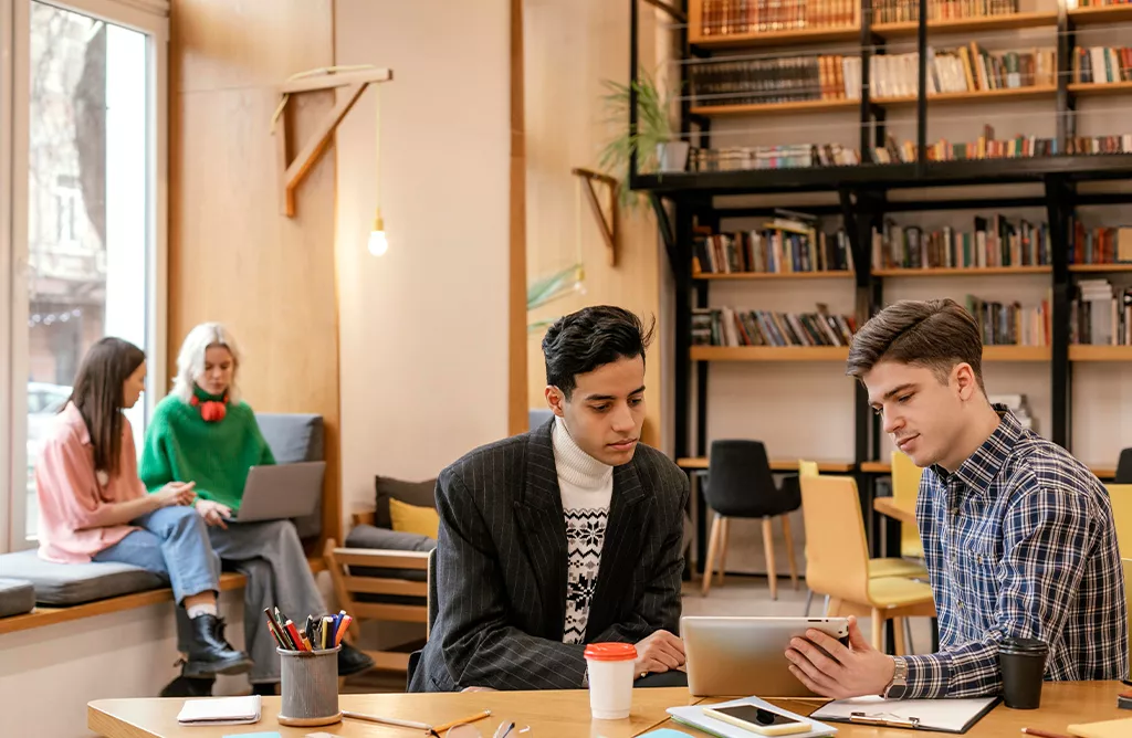 Students studying together at a university campus.