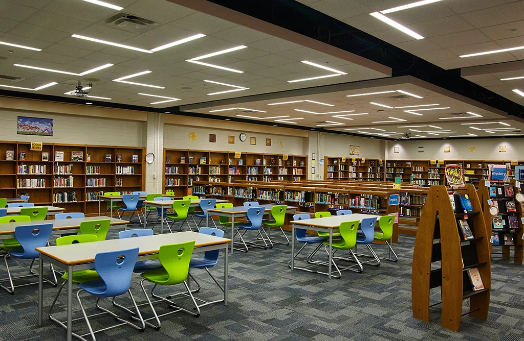 International Students Exploring Academic Resources in a Modern Library